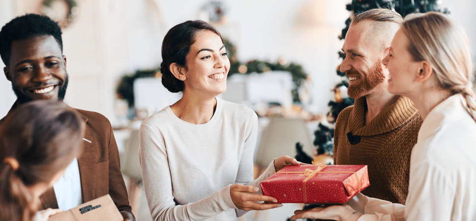 group of friends exchanging holiday gifts